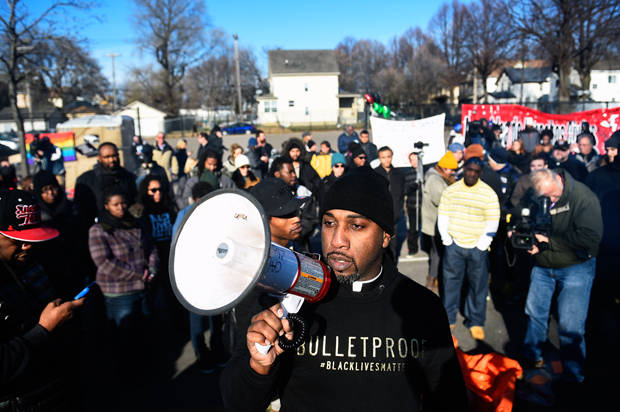 Danny Givens Jr. of St. Paul, Minnesota speaks to a gathering crowd of the group Black Lives Matter before they march to city hall during a protest in Minneapolis, Minnesota